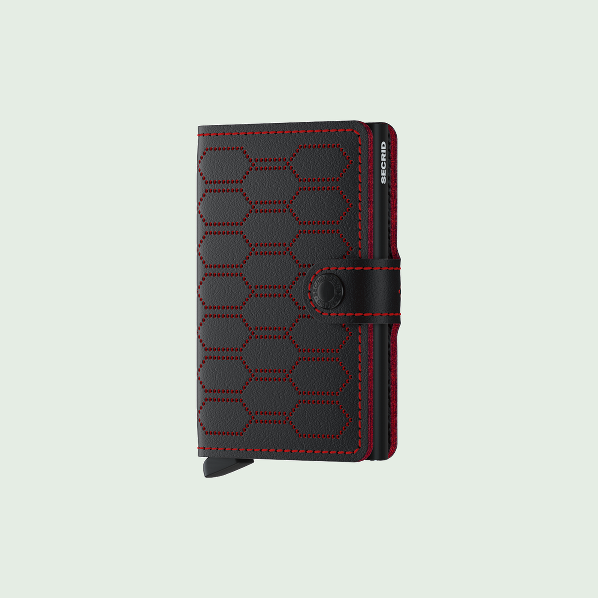 Secrid Miniwallet Fuel Black-Red tegen een zachte pastelachtergrond (saliegroen)