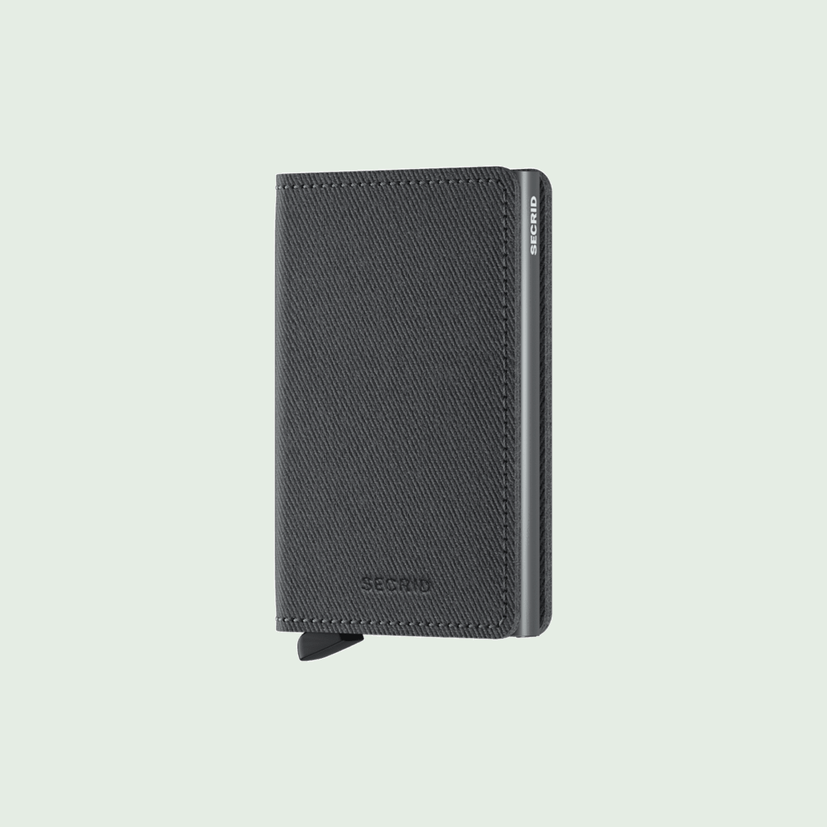 Secrid Slimwallet Twist Grey tegen een zachte pastelachtergrond (saliegroen)