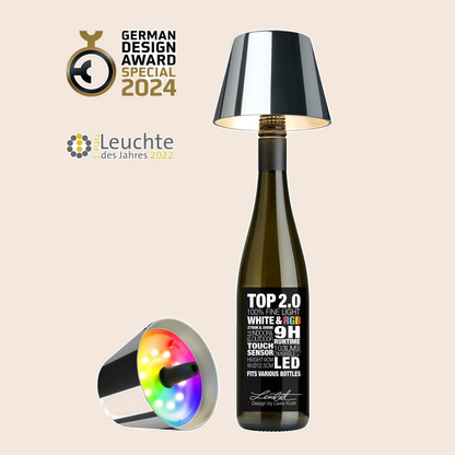 Sompex TOP 2.0 oplaadbare flessenlamp – Chroom tegen een zachte pastelachtergrond (perzik)